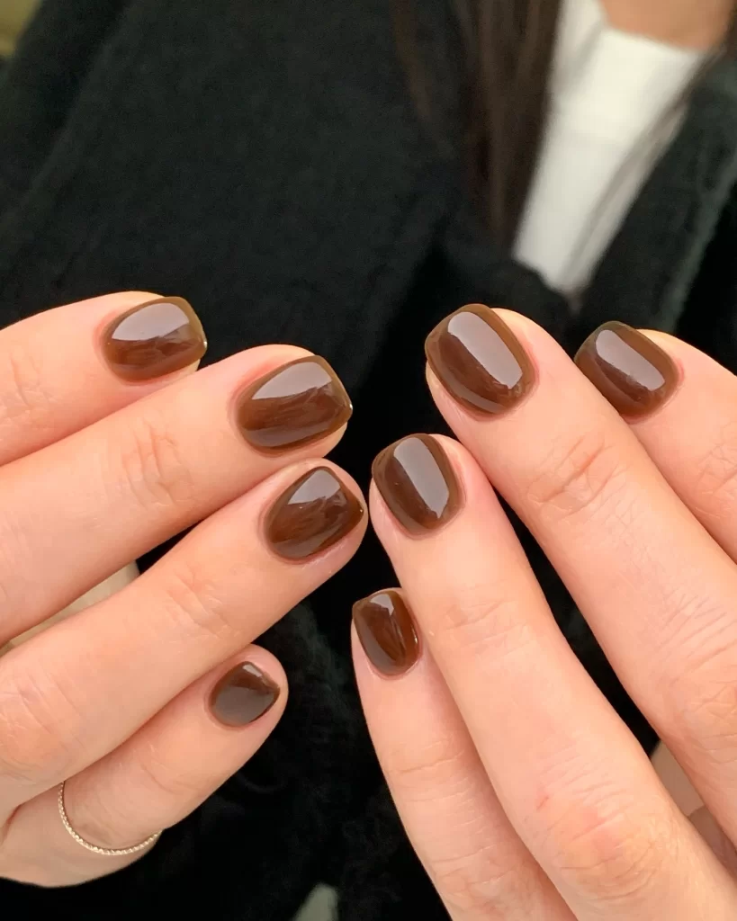 Glossy brown cute short neutral nails styled in minimal Korean aesthetic