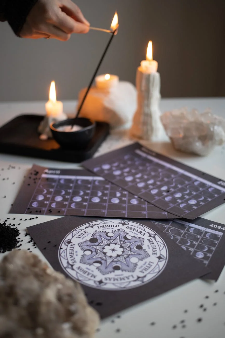 hand burning aromatherapy stick in bowl
