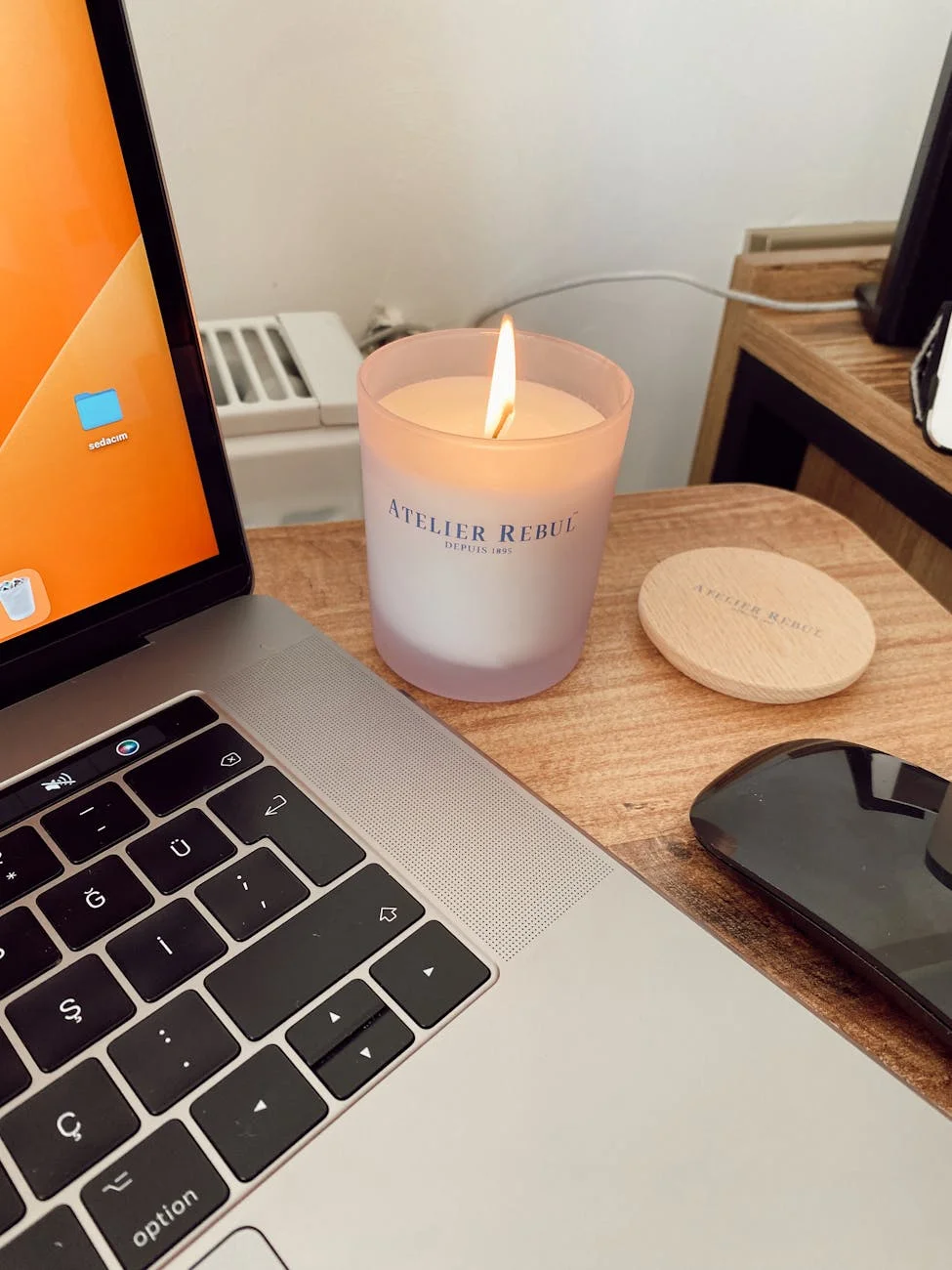 wax candle near laptop