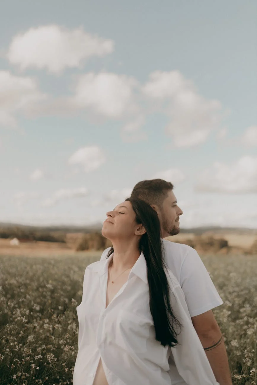 romantic couple embracing in a blooming field