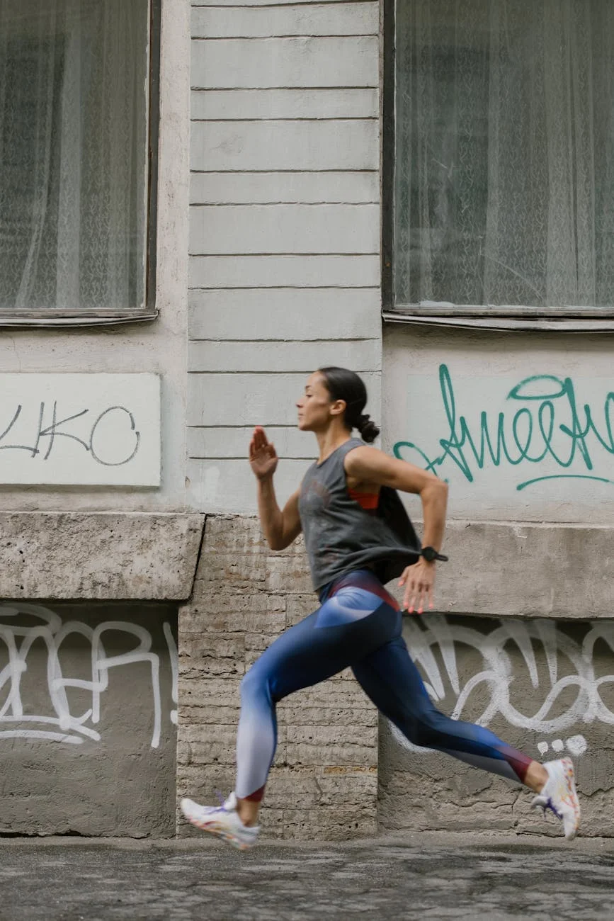 a side view of a woman jogging on the street