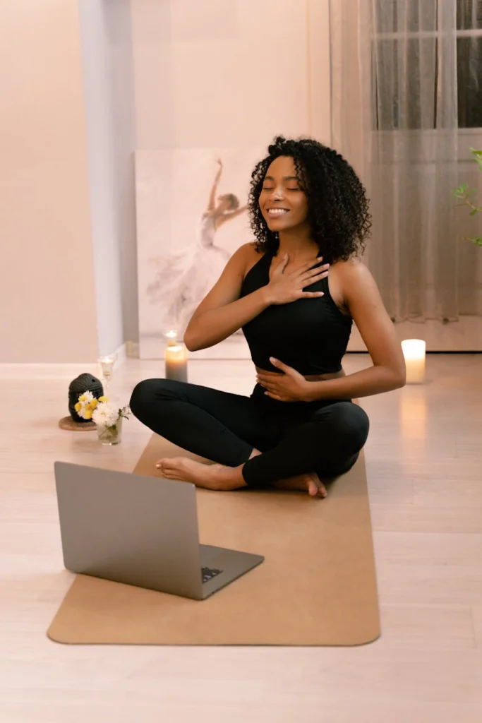 woman with curly hair doing yoga