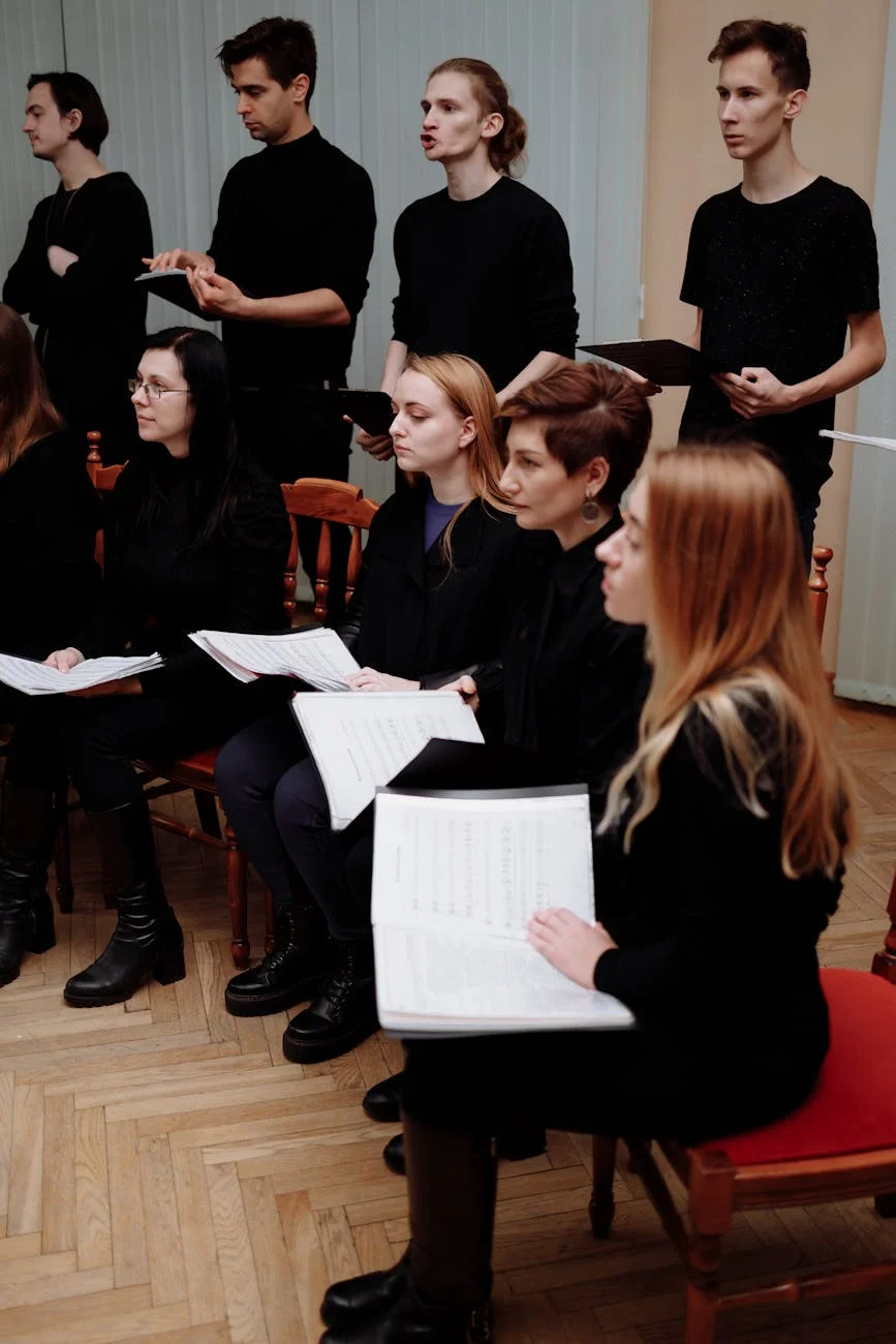 people in black clothes in a room