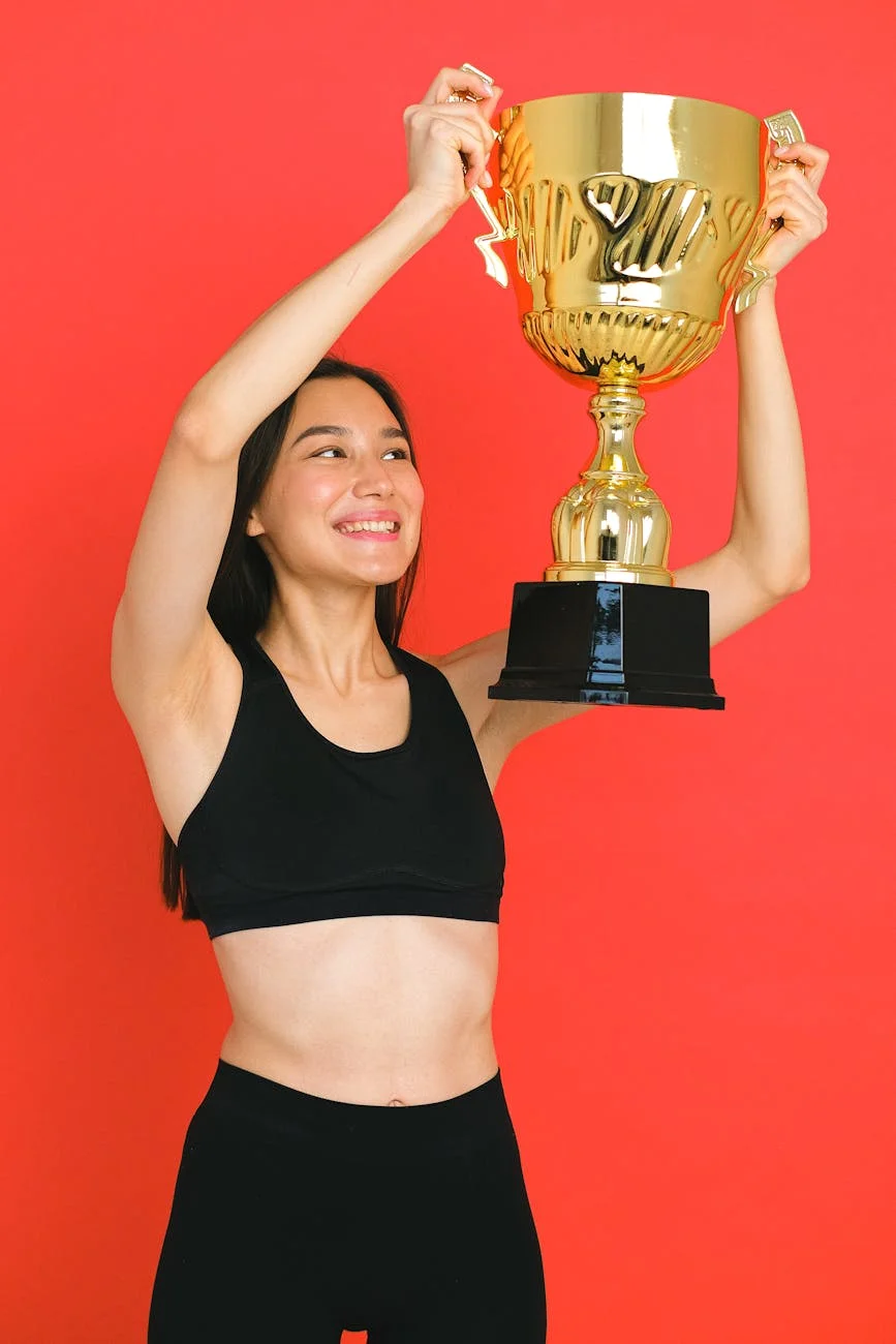 a woman holding a trophy