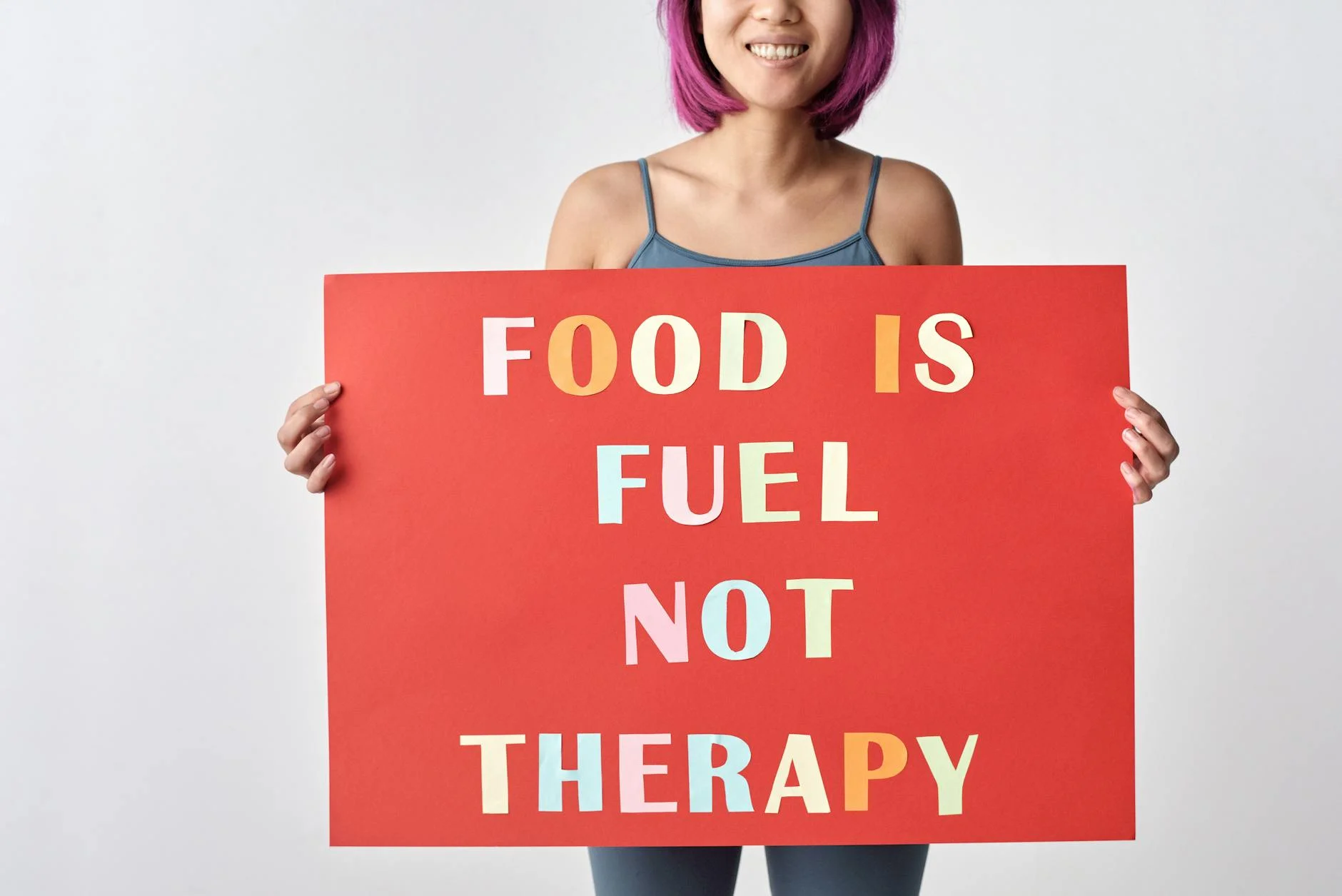 a woman holding a poster