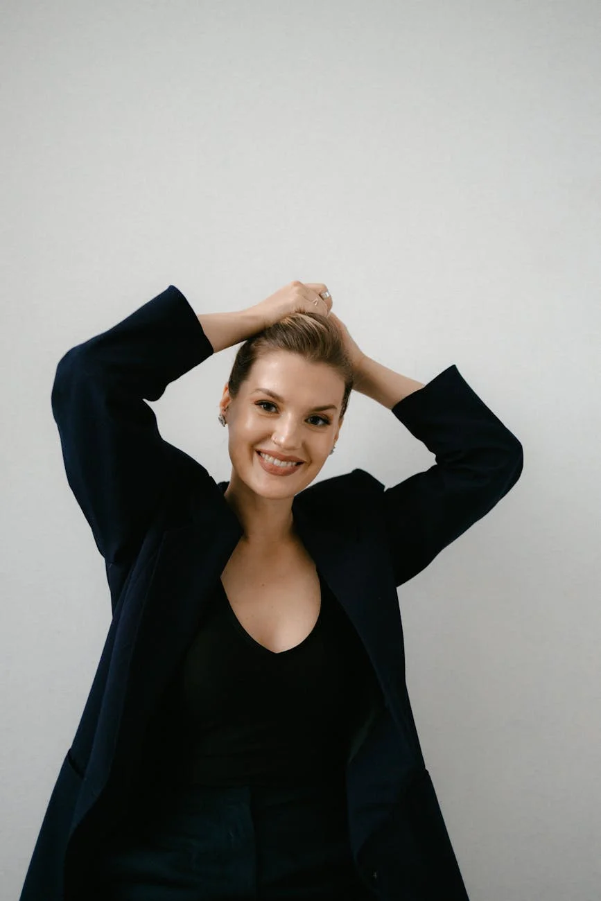 woman in black blazer smiling