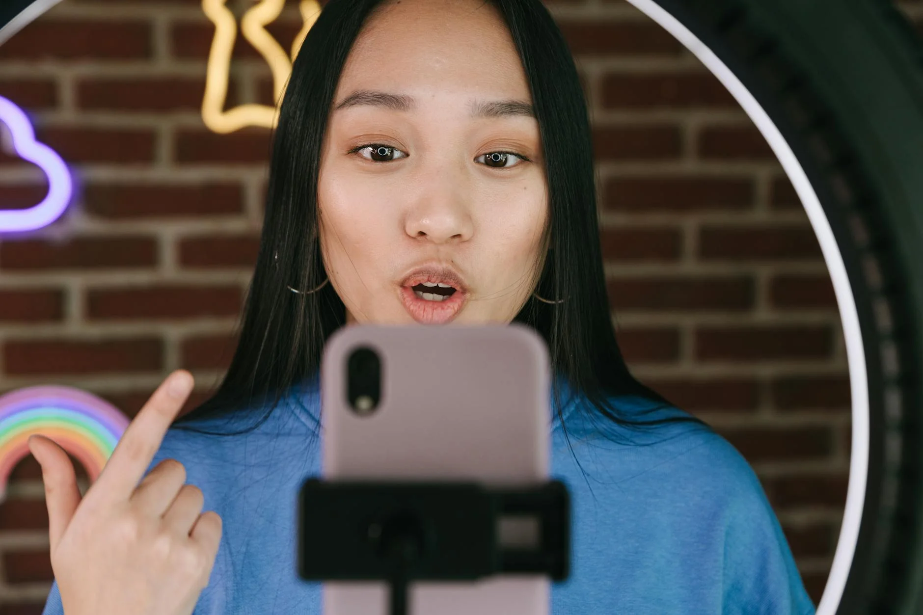 a woman recording herself with a smartphone