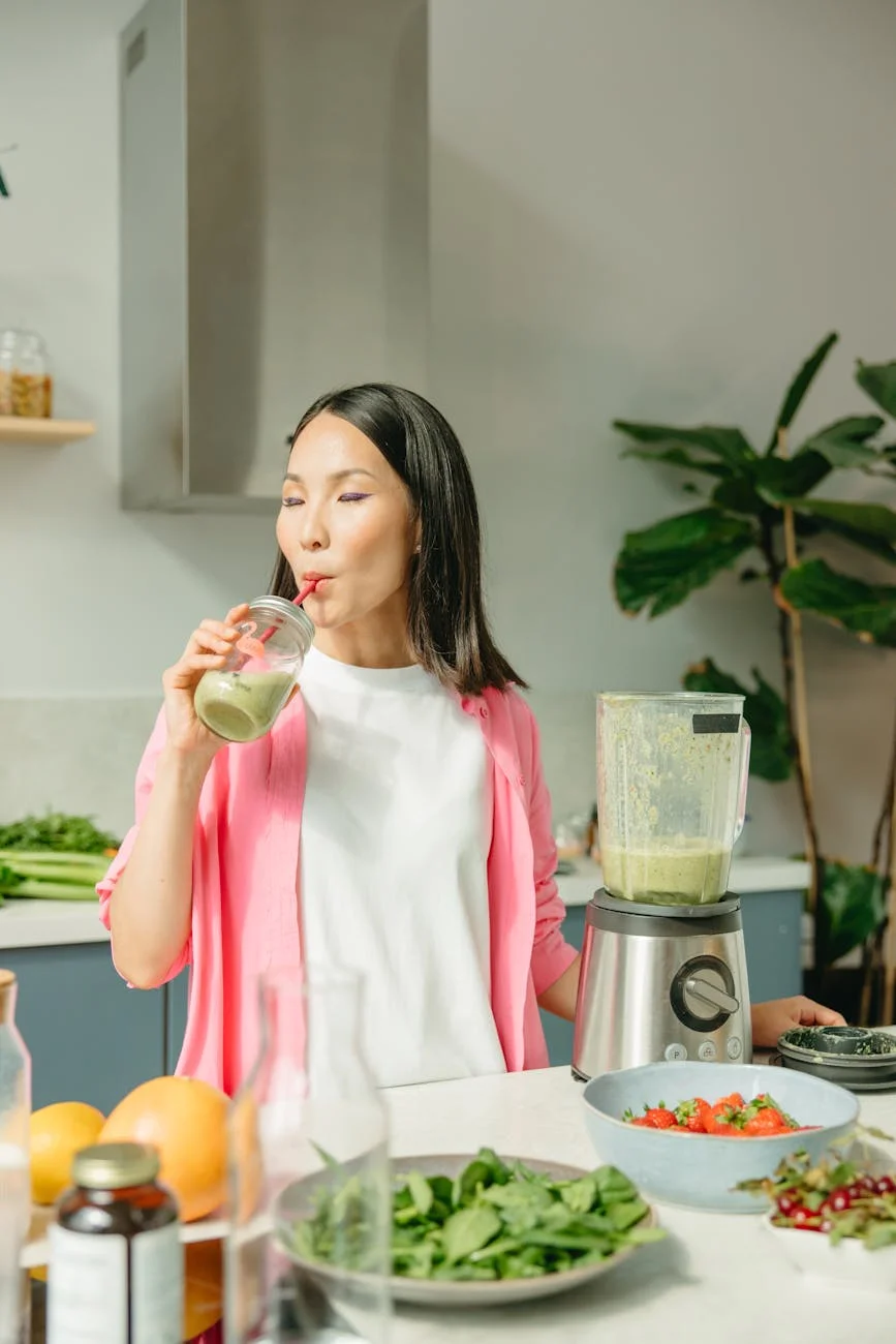 woman drinking a smoothie