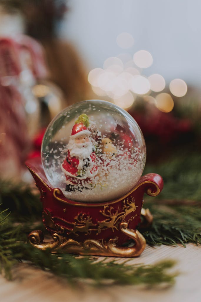 Charming snow globe featuring Santa Claus in a festive setting. Perfect for holiday decorations.