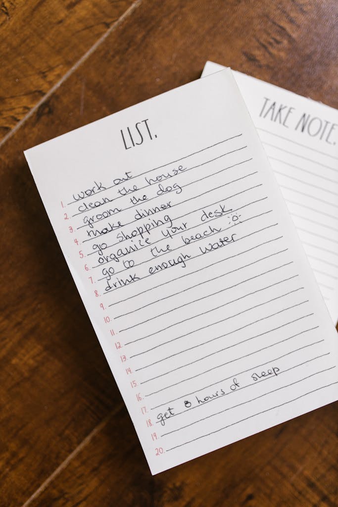 Close-up of a handwritten to-do list on a wooden table for an organized day.