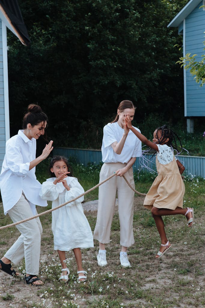 Family enjoying an outdoor game of tug of war, showcasing joy and togetherness.