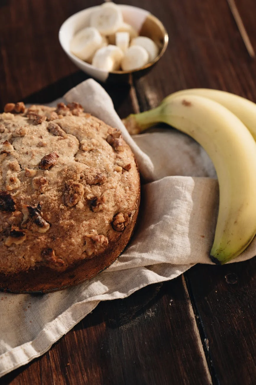 banana bread and bananas on white cloth