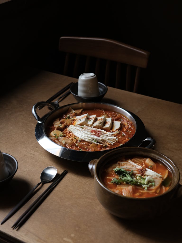 Savory Korean hot pot with tofu, mushrooms, and vegetables, perfect for a cozy meal.