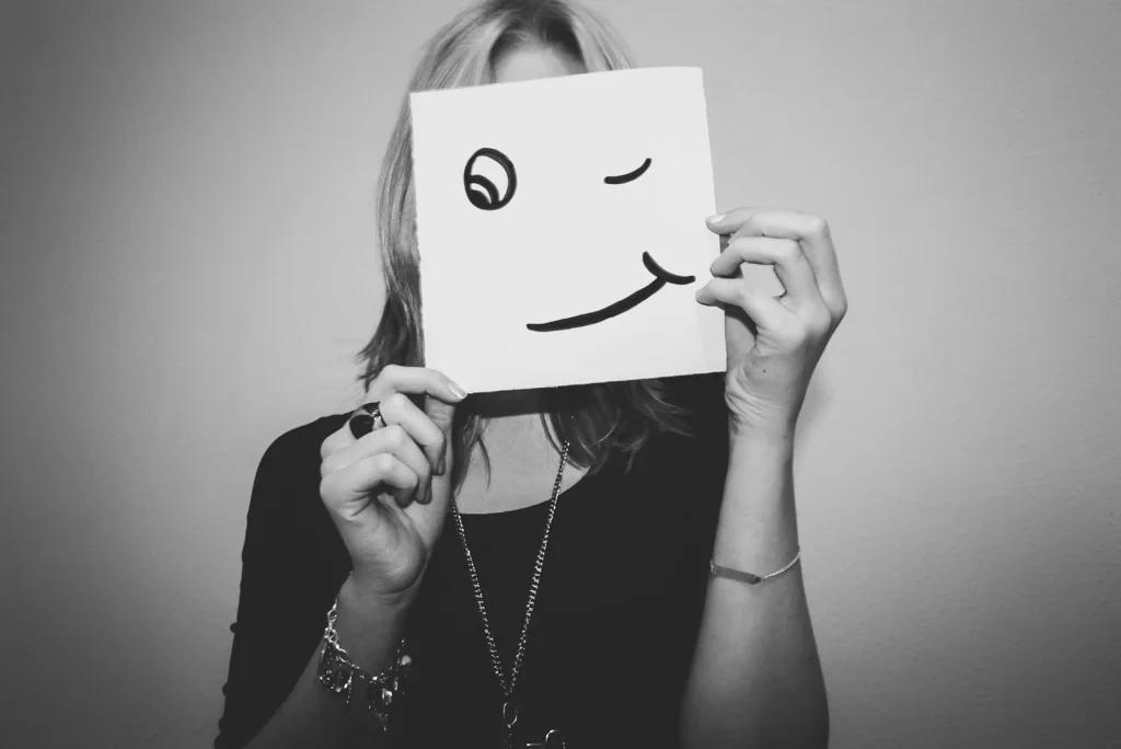 woman holding white printer paper