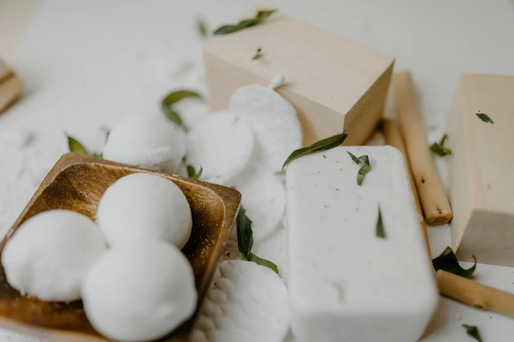 Elegant arrangement of spa essentials with natural soap and bath bombs, perfect for self-care routines.