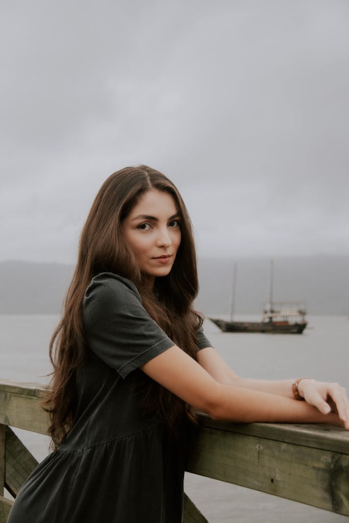A serene portrait of a woman by the Brazilian coast, exuding natural beauty and tranquility.