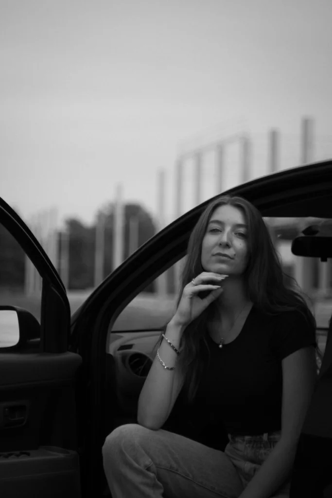a woman sitting in a car