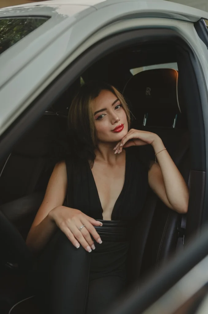 a woman sitting in a car