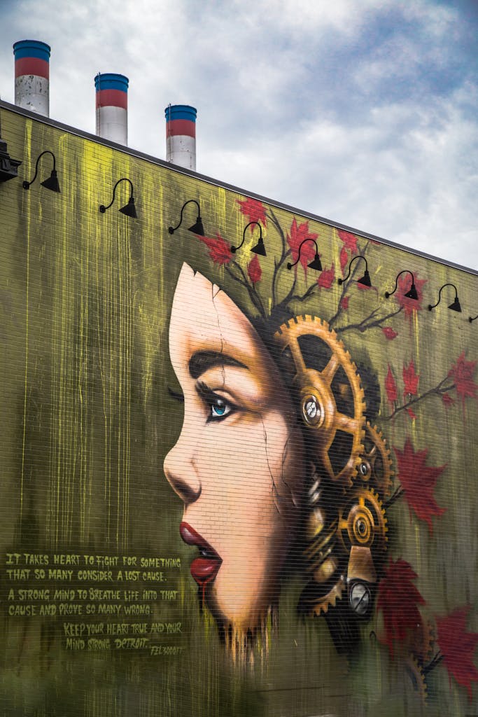 Colorful mural featuring a woman's profile with gears on a Detroit building.