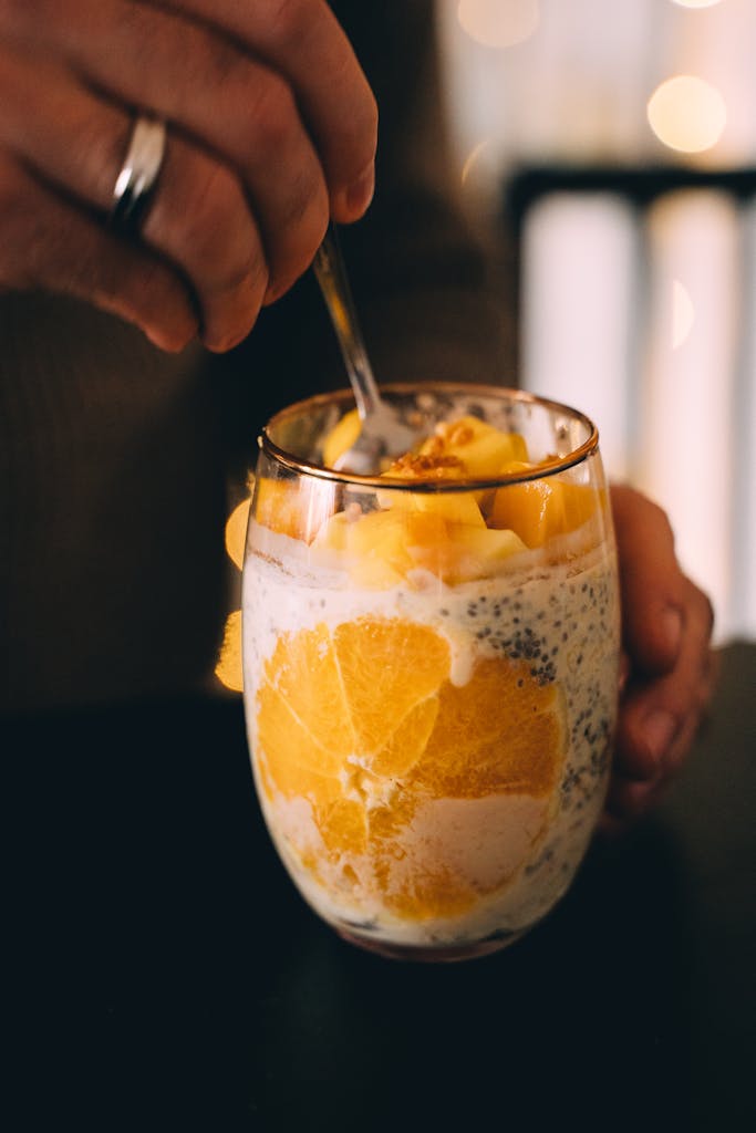 Delicious chia pudding with mango and orange served in a glass for a healthy breakfast.