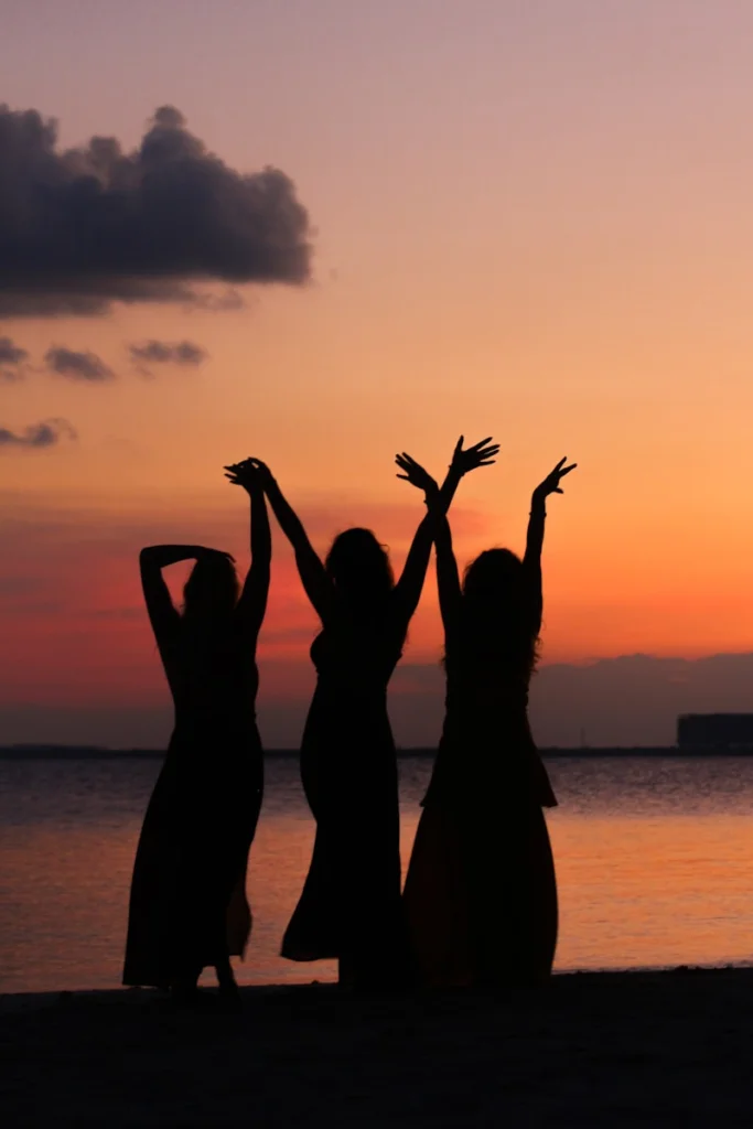 a group of people raising their hands