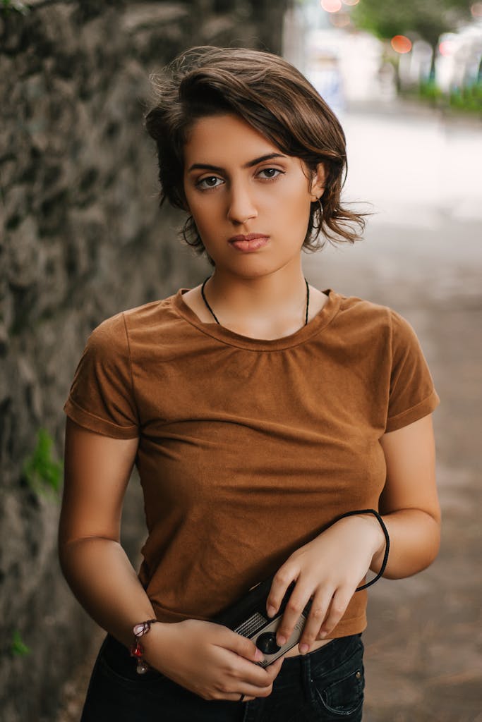 Portrait of a fashionable young woman standing outdoors in São Paulo, Brazil.
