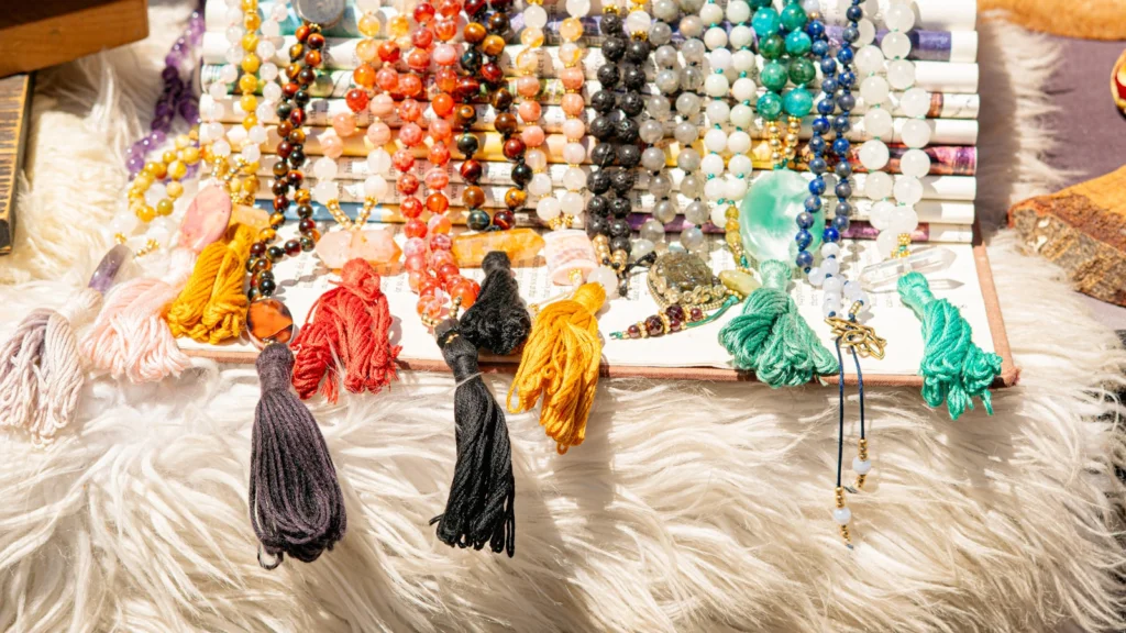 Colorful jewelry and tassels are displayed.
