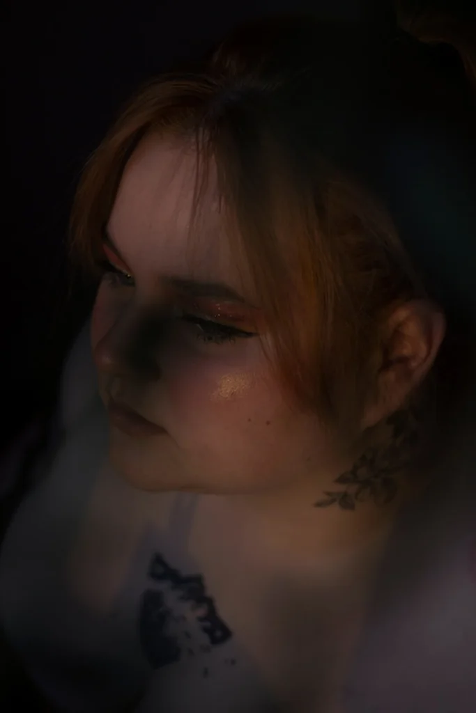 a person with a flower in the hair