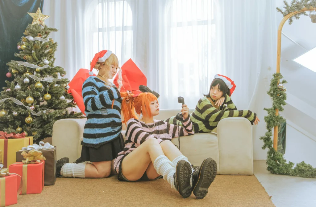 a couple of women sitting on top of a couch