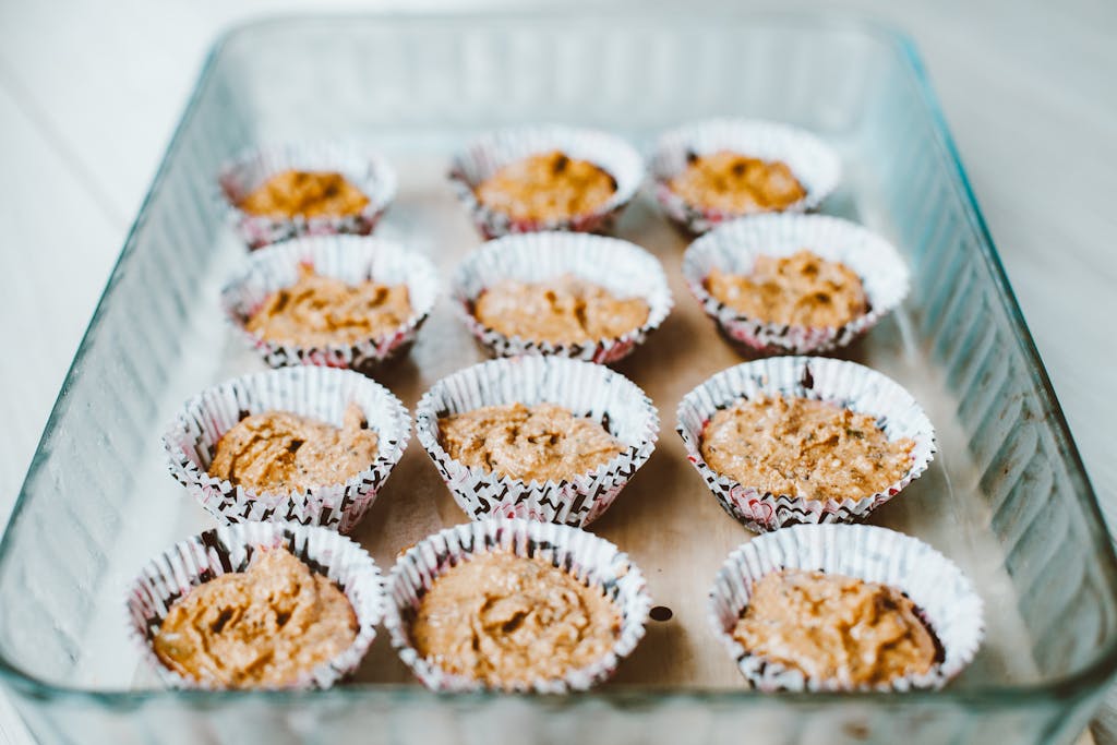 Delicious homemade muffins in cupcake liners ready for baking. Perfect for a fresh dessert.