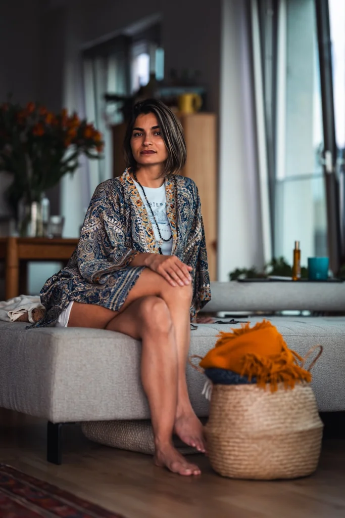 A woman sitting on a couch in a living room