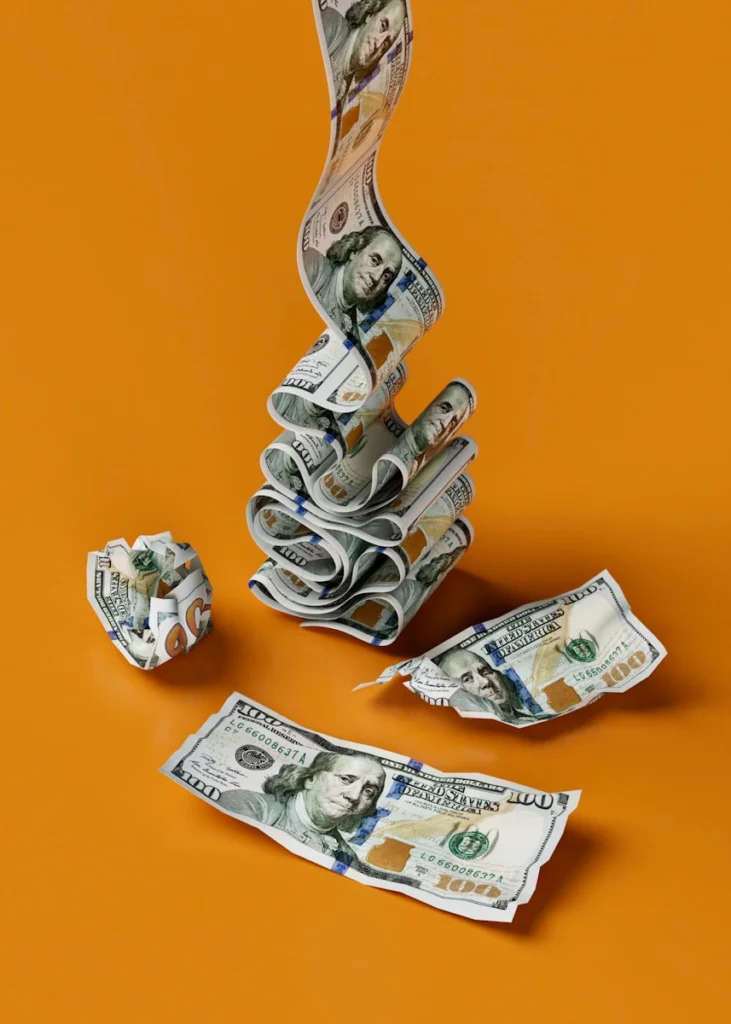 a stack of money sitting on top of a table