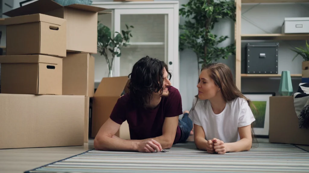a couple of people that are sitting on the floor
