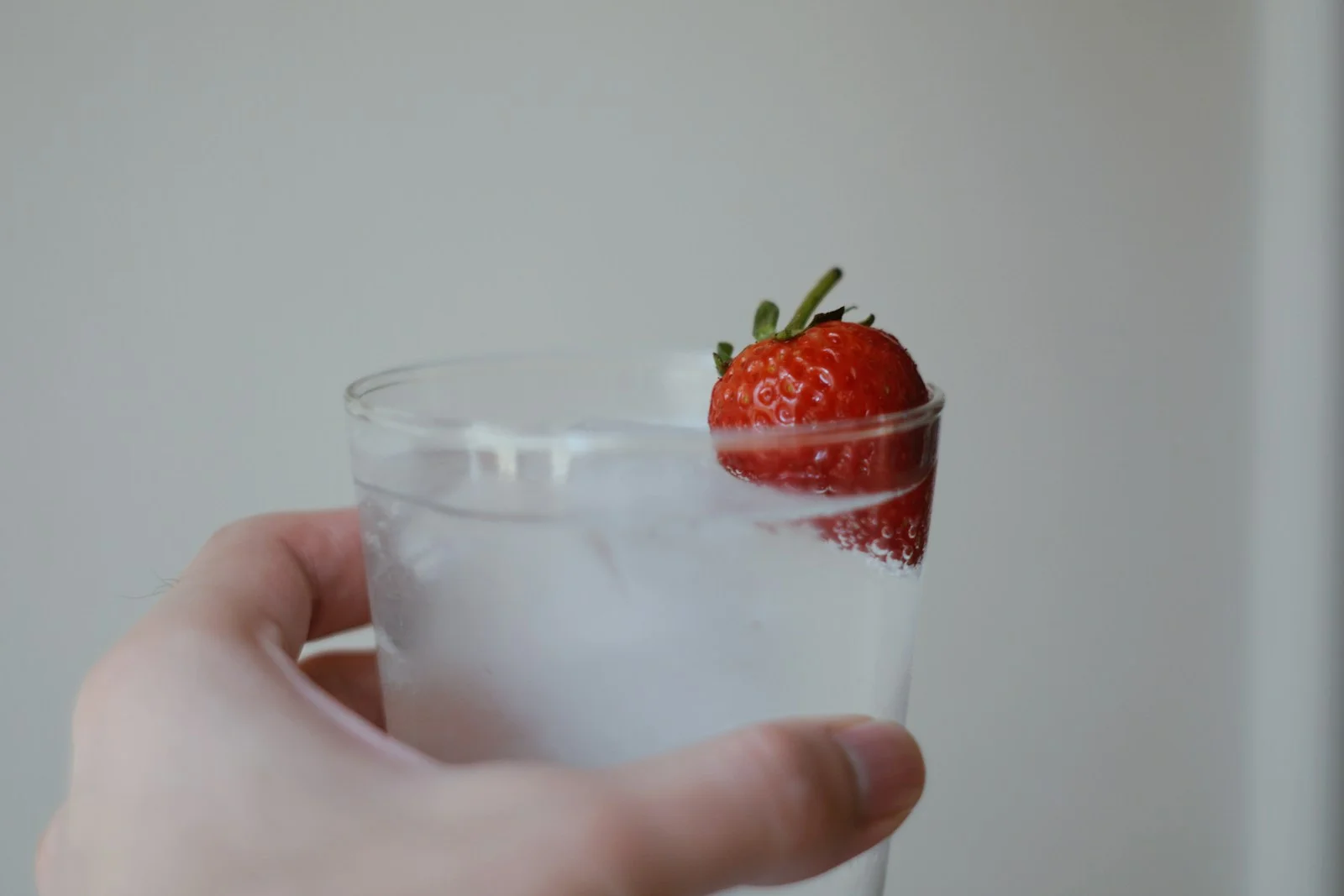 strawberry in clear drinking glass