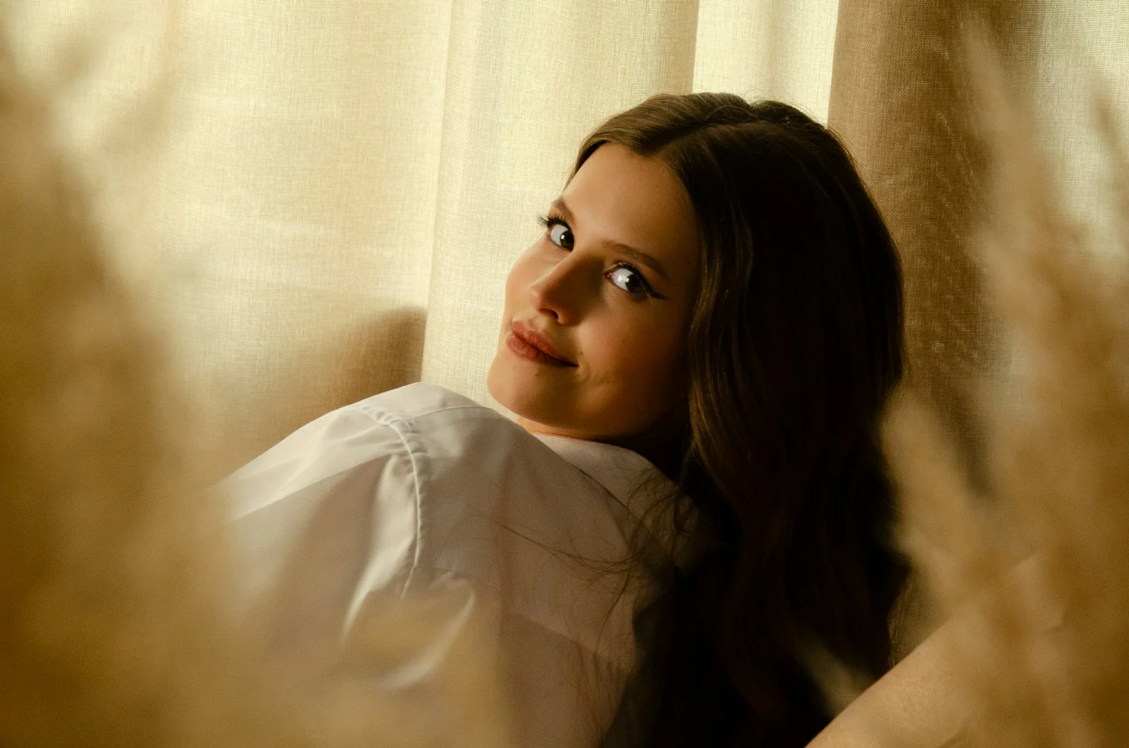 A woman looking at herself in a mirror