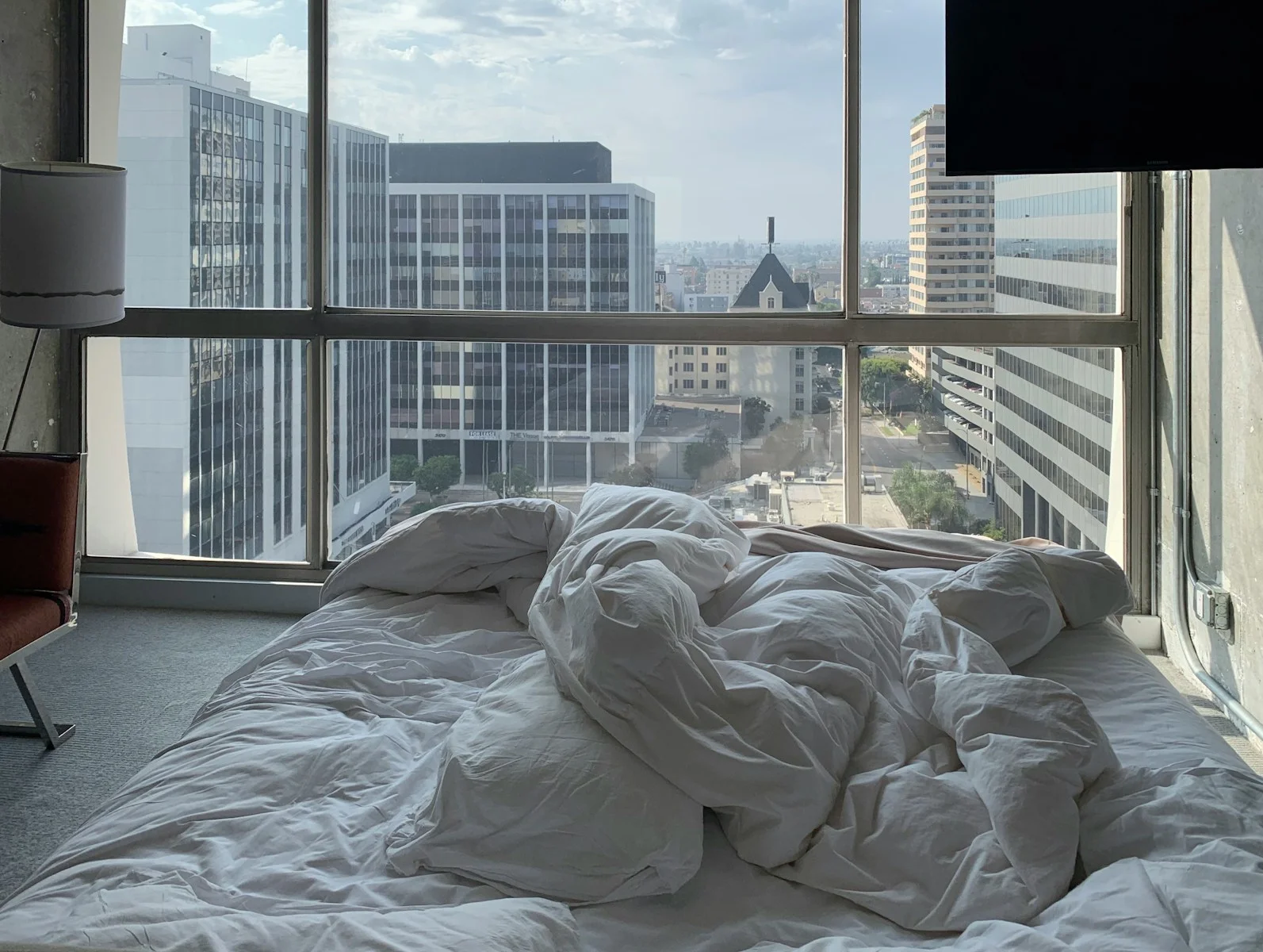 white bed linen on bed