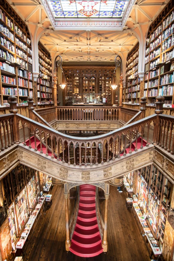 Stunning view of the iconic Livraria Lello's grand staircase and bookshelves in Porto, Portugal.