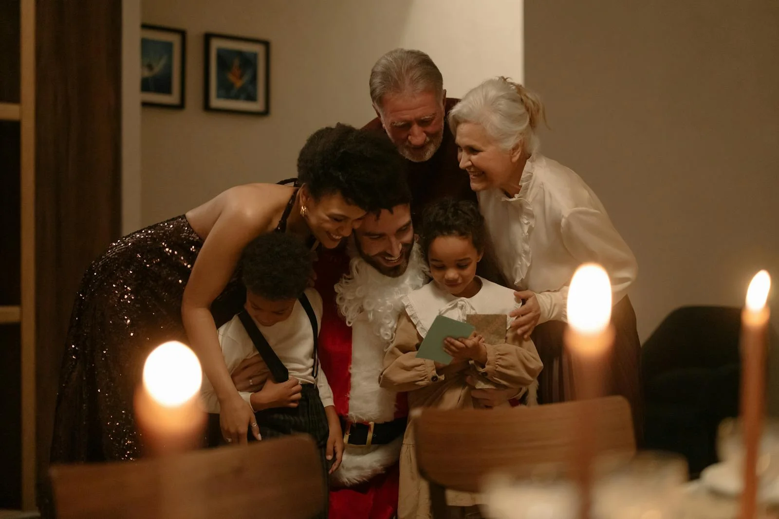 A joyful family gathers around Santa for a warm Christmas Eve celebration, sharing love and happiness.