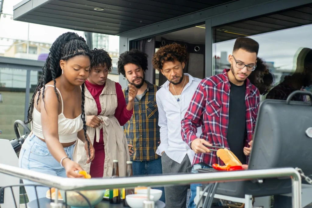 A group of friends enjoying a barbecue on a sunny day in Portugal, showcasing leisure and friendship.