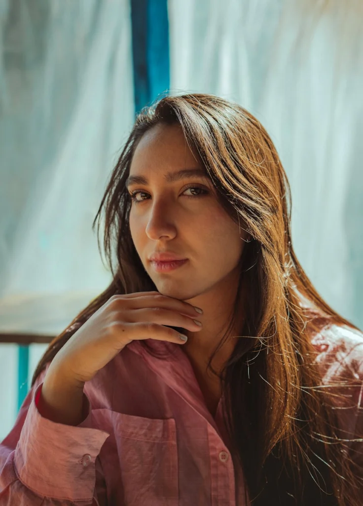 A young woman poses for a portrait.