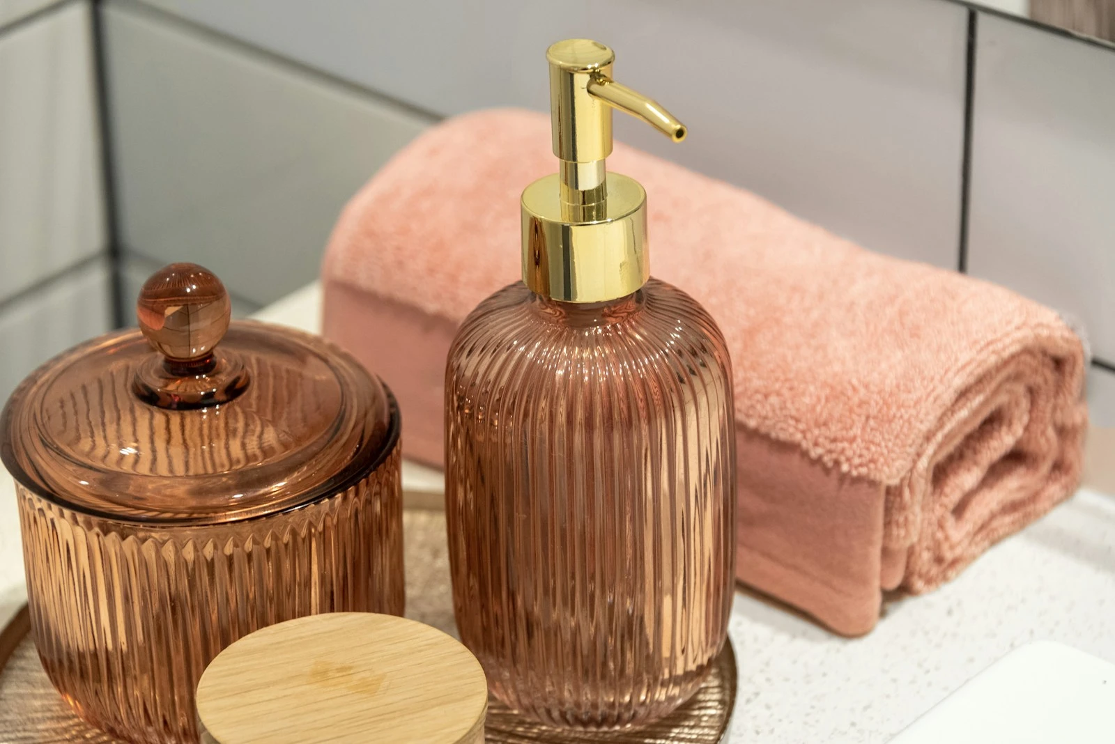 a bathroom sink with a soap dispenser and a soap dish