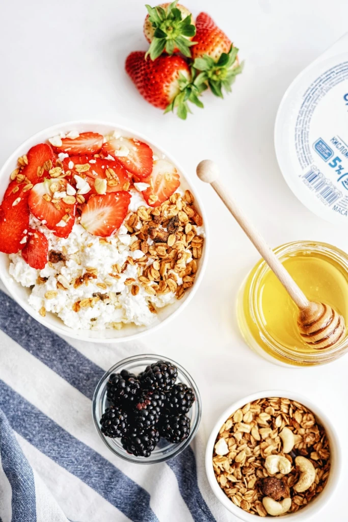 strawberry and blackberry on white ceramic bowl