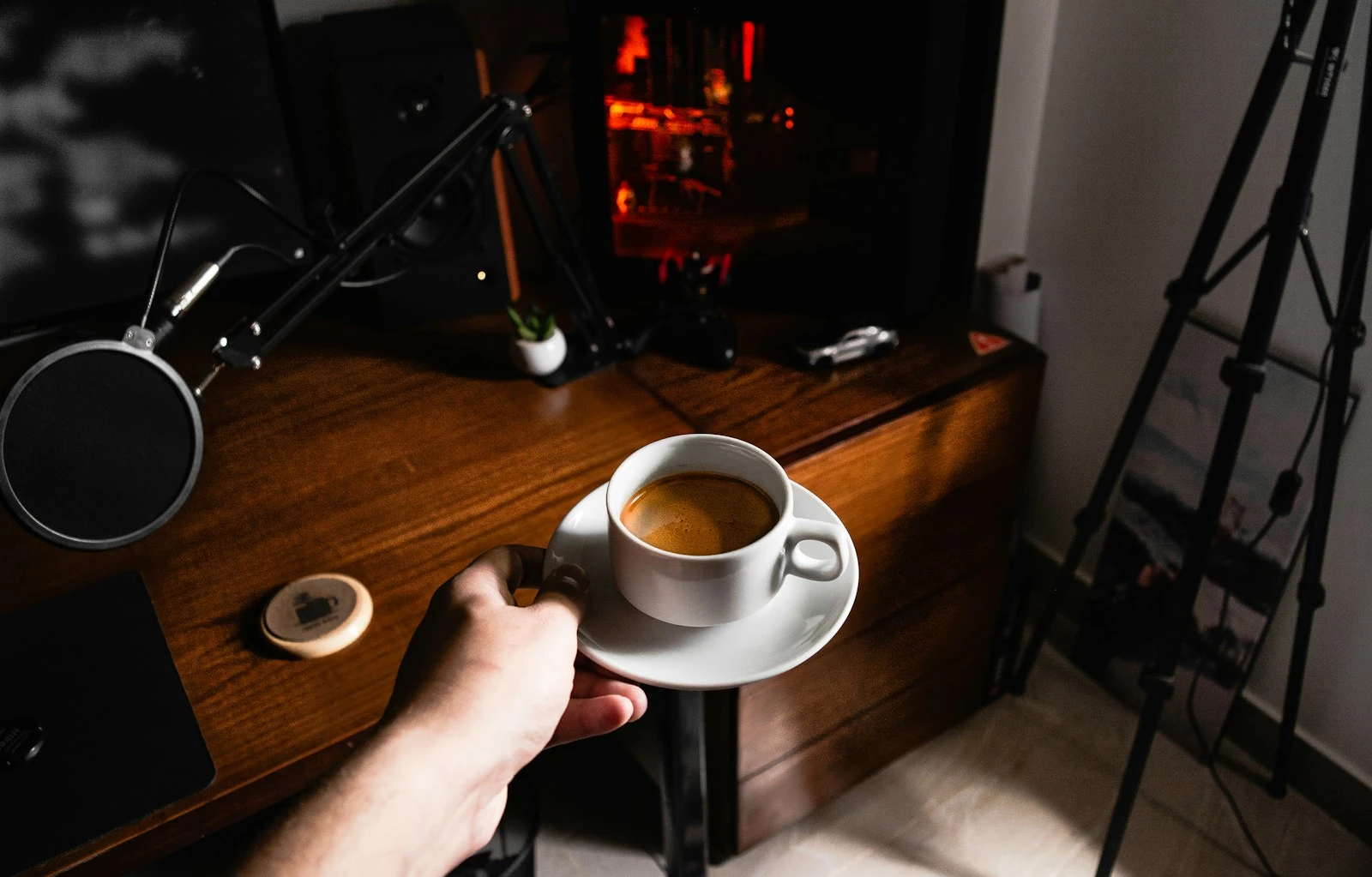person holding white ceramic mug with coffee