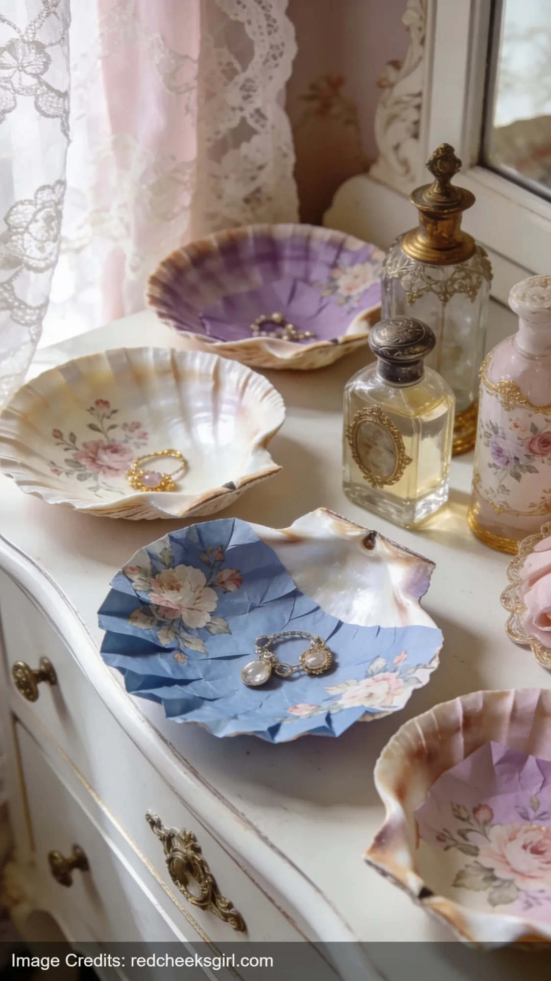 Decoupage seashell trinket dishes with floral patterns on vintage white dresser