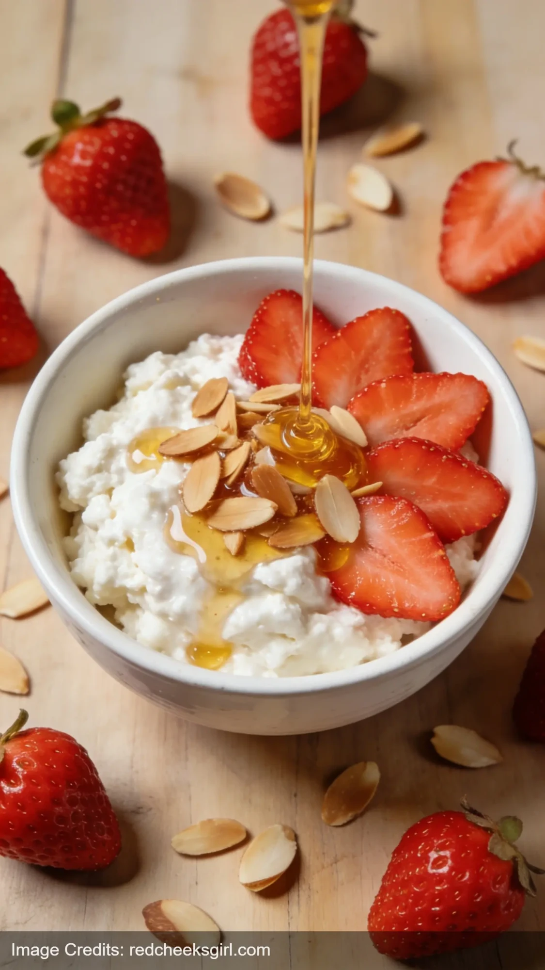 high protein strawberry cottage cheese bowl with fresh strawberries and almonds