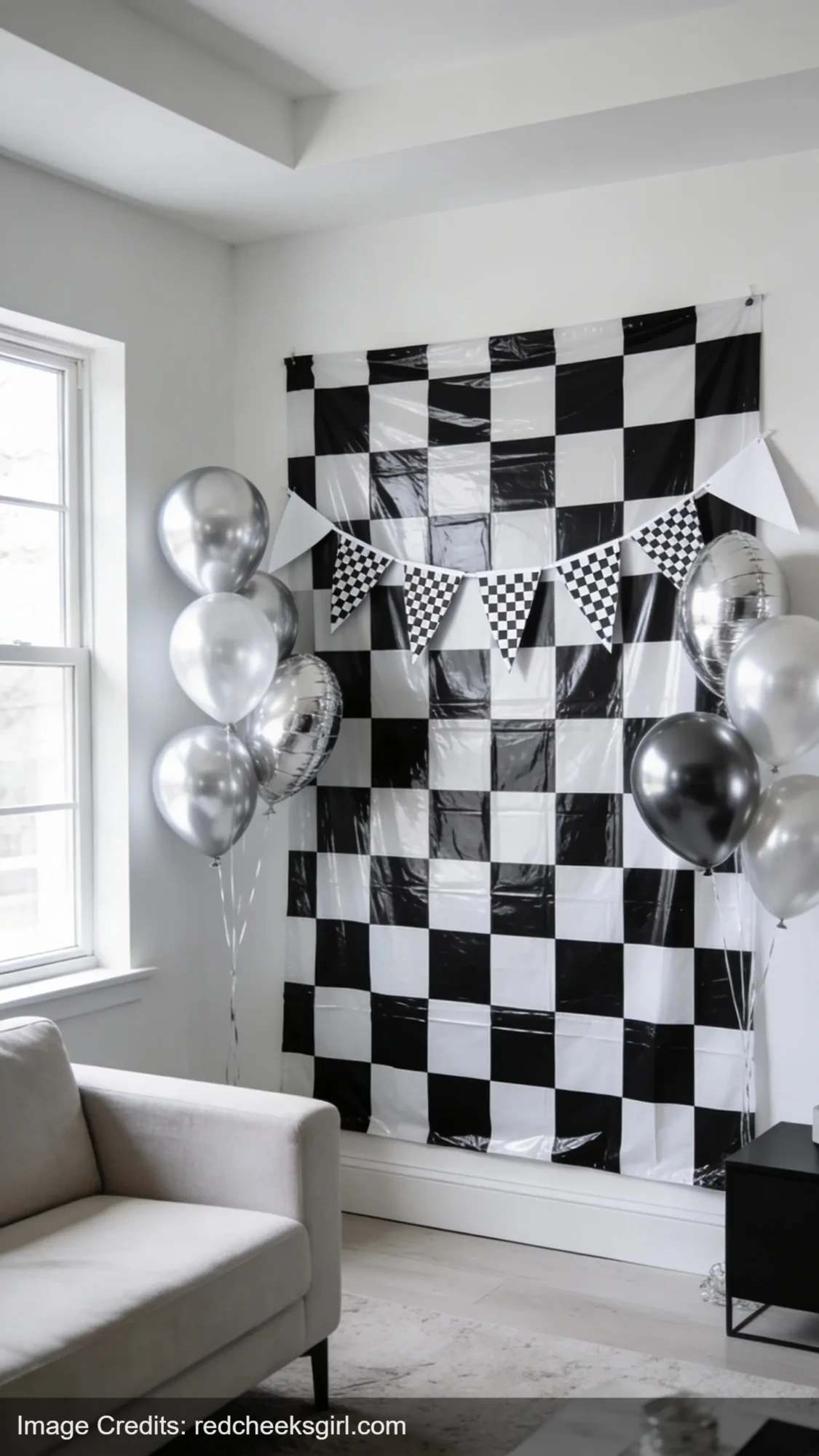 DIY pit stop party backdrop with checkered pattern and racing decorations for car birthday party