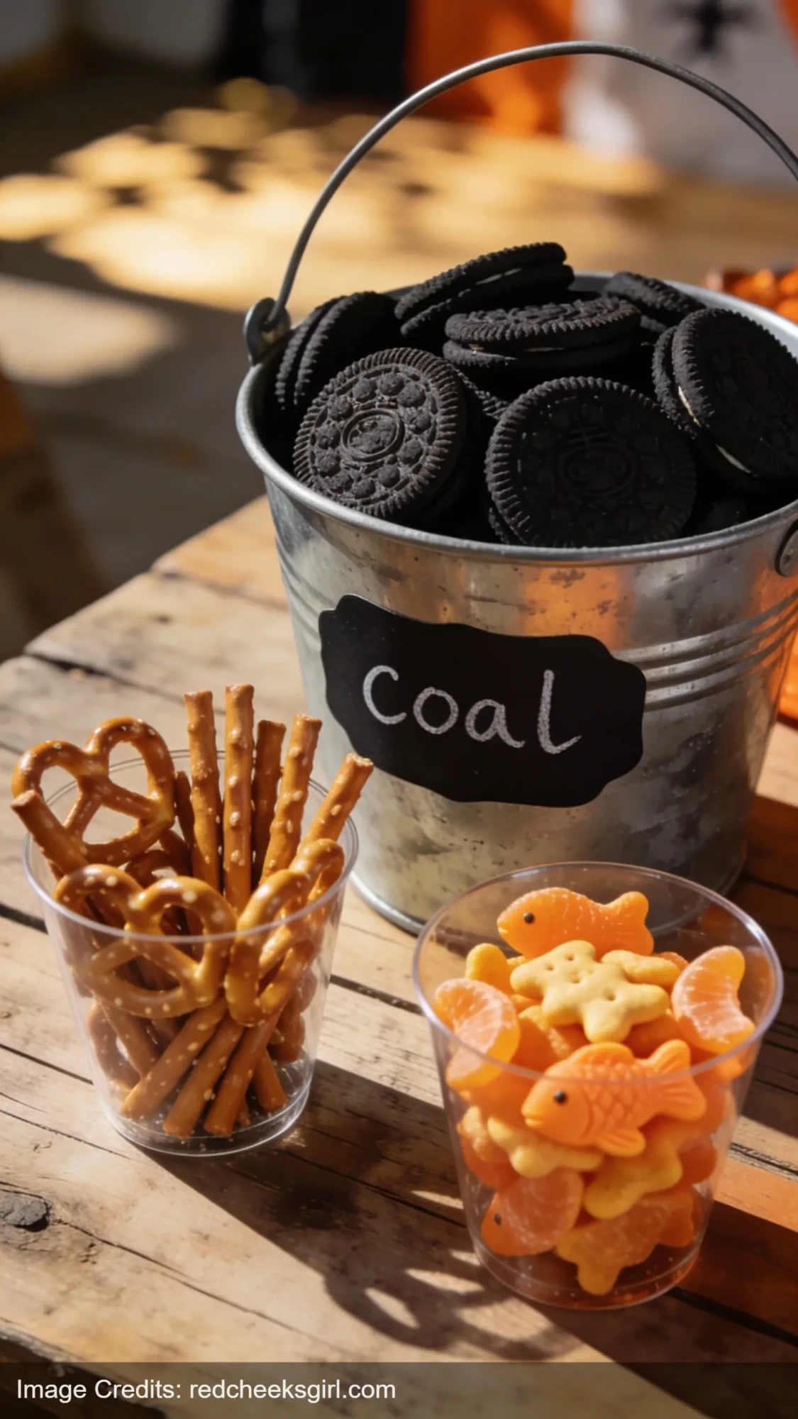 Train party snack display with Oreo coal bucket and cargo cups filled with treats