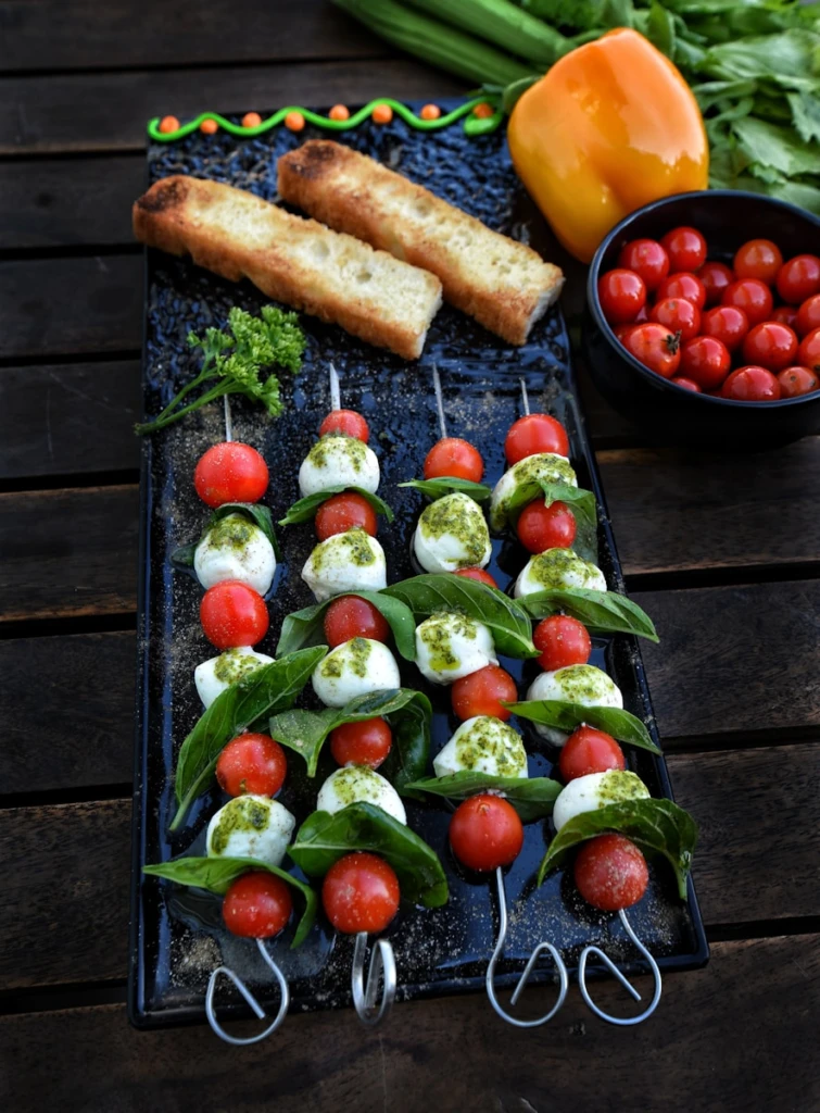 Caprese skewers with tomatoes, mozzarella, and basil