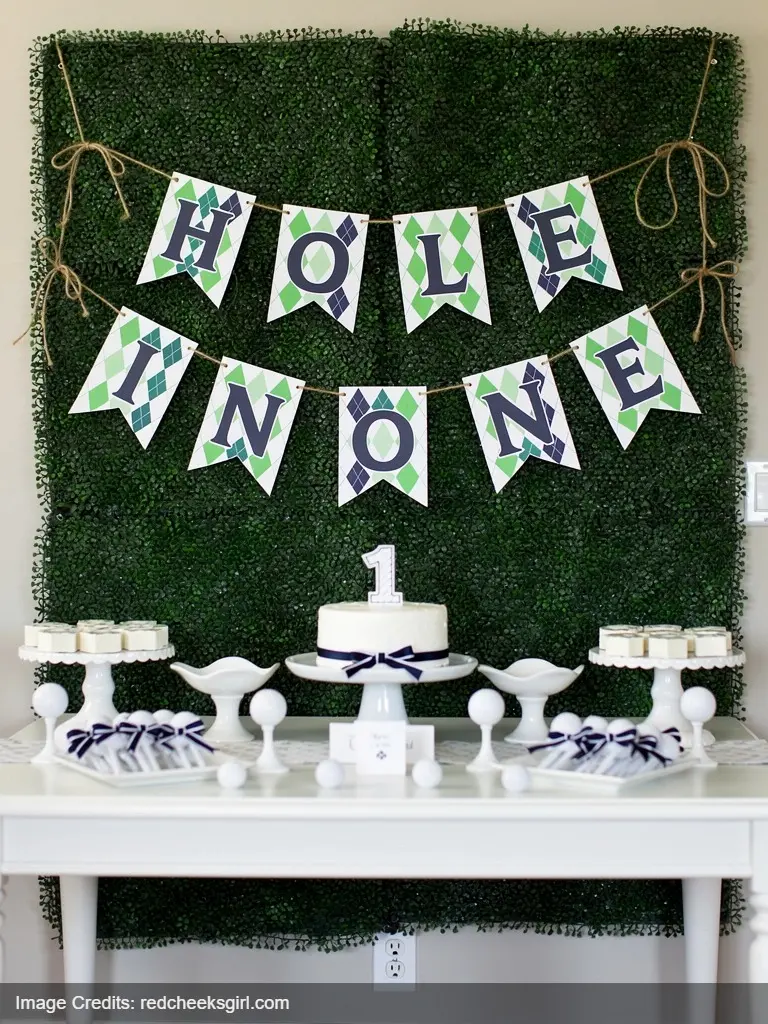 DIY argyle pattern banner spelling HOLE IN ONE for preppy golf themed first birthday party