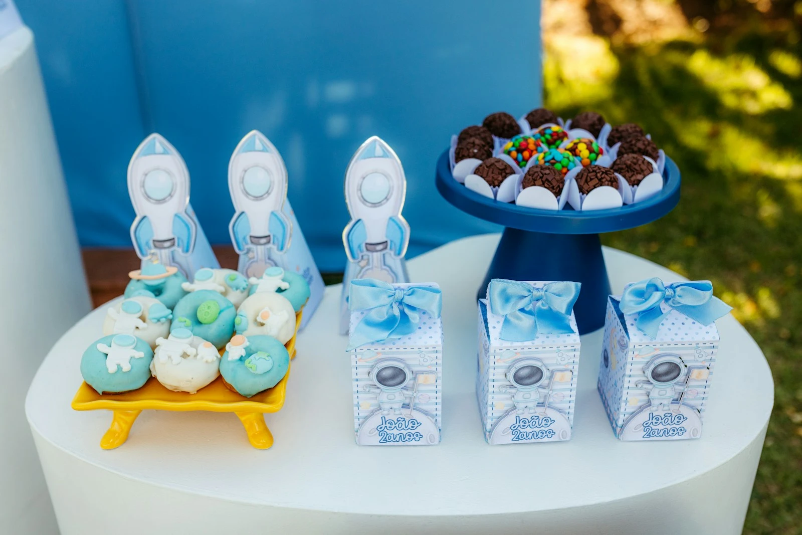 Space-themed party treats with rocket decorations.
